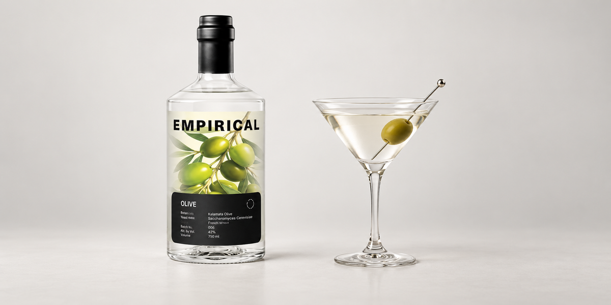 Empirical Olive bottle beside its cocktail