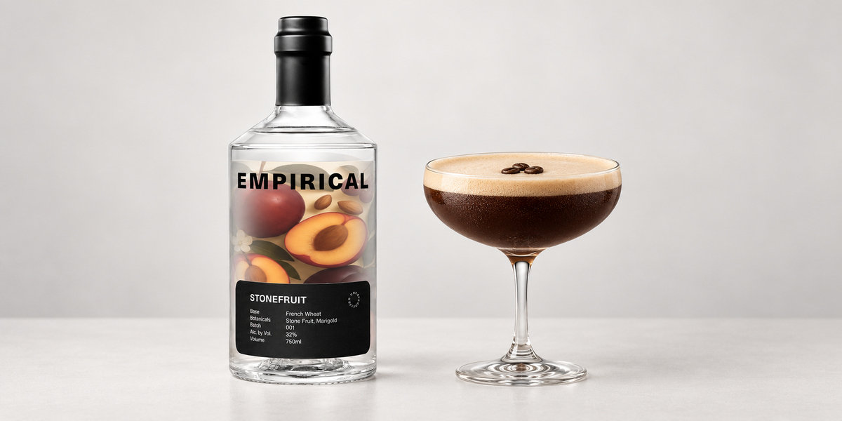 Empirical Stonefruit bottle beside its cocktail