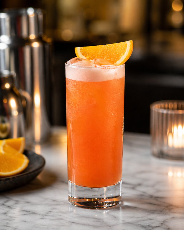 Garibaldi Symphony cocktail with orange garnish